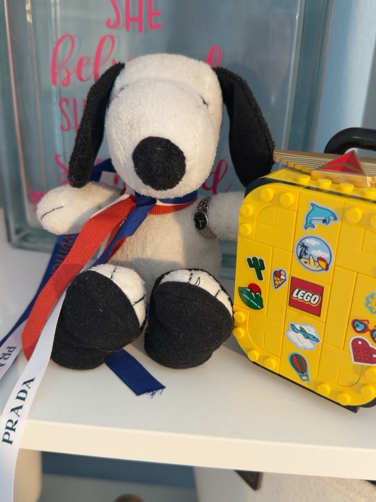 International Snoopy with a yellow LEGO suitcase