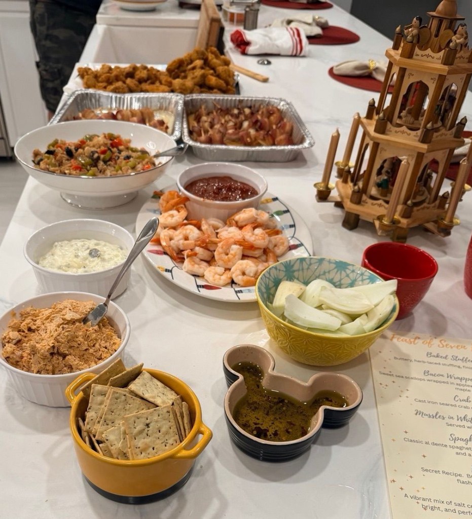 Kitchen island filled with dishes prepared for a Feast of the Seven Fishes gathering.